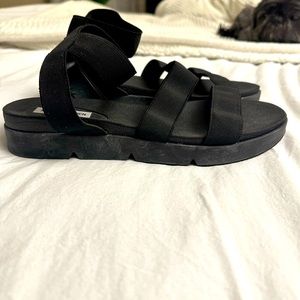 Black stretch ankle sandals by Steve Madden